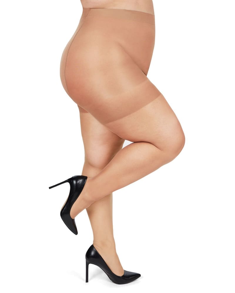 Side of a model wearing a size 1X-2X Plus Size Curvy Silky Sheer Control Top Pantyhose in Honey by Memoi. | dia_product_style_image_id:299623